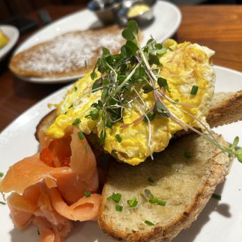 Sibling by Pushkin's - Avacado toast. But instead of the poached egg, I got scrambled. way too much bread though. Vegan pancake in the back was HELLLAAA GOOD - New American Near Me - Sacramento, California