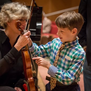 Chicago Philharmonic - Violinist Sheila Hanford shows off her "equipment." Photo by Elliot Mandel. - Performing Arts Near Me - Chicago, Illinois