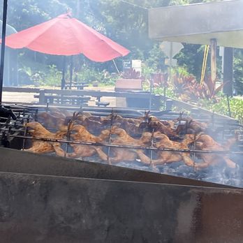Yummy Huli Huli Chicken - Chickens being smoked outside - Chicken Shop Near Me - Kaneohe, Hawaii