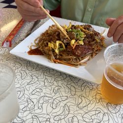 Pad Thai topped with crispy duck.