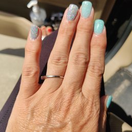Dip manicure in silver glitter and light blue glitter