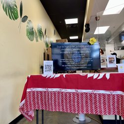 Mochiko Hawaiian BBQ and Deli - Inside showing the QR code to order food with screen showing message.