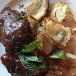 Eivin's Bar & Bistro - Two lamb shanks with Kumara (a sweet potato) and regular potatoes and onions. $16 for the first shank, $8 for the second.