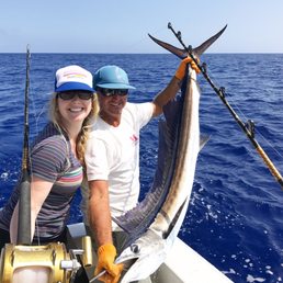 Captain Bobby + the Spear Fish he rigged us up to catch.