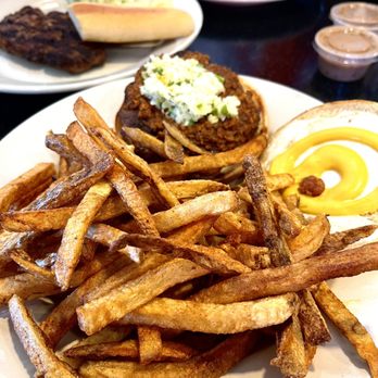 Graham Soda Shop & Grill - 1/3 lb. Carolina Burger With home cut fries sitting in front of a hamburger steak and salad. - American Near Me - Graham, North Carolina
