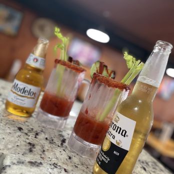 La Fruta Feliz 2 - three glasses of beer and a bottle of beer - Mexican Near Me - Austin, Texas La Fruta Feliz 2 - three glasses of beer and a bottle of beer - Mexican Near Me - Austin, Texas