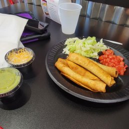 Taquito with topping on side