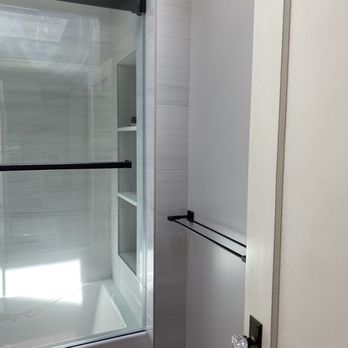 Carrillo Construction - a bathroom with a glass shower door - General Contractors Near Me - San Bruno, California