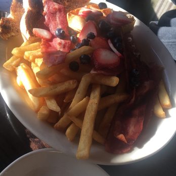 Dinerbar - The deluxe (as per menu : 2 eggs, tri color home fries, bacon OR sausage and a choice of pancakes, waffles or French toast) - $16.00 - Diners Near Me - Rego Park, New York Dinerbar - The deluxe (as per menu : 2 eggs, tri color home fries, bacon OR sausage and a choice of pancakes, waffles or French toast) - $16.00 - Diners Near Me - Rego Park, New York
