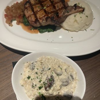 Granger's - Grilled Pork Chop 14 oz Wild Mushroom Risotto with Seasonal Veggies - Seafood Near Me - Houston, Texas