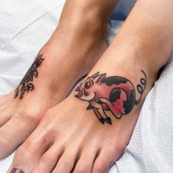 Rocky Shores Tattoo - Pig and rooster.  Traditional Military tattoos by: Tattoo Artist: Jen Beirola
Rocky Shores Tattoo Company
Middletown, Rhode Island.