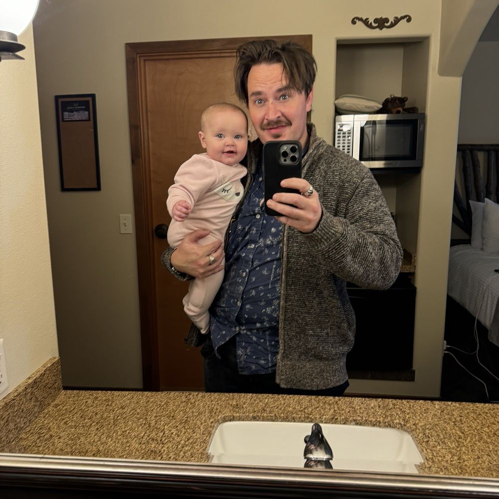 Bavarian Lodge - My daughter and eye snapping our reflection in the vanity mirror of our third floor room. - Hotels Near Me - Leavenworth, Washington Bavarian Lodge - My daughter and eye snapping our reflection in the vanity mirror of our third floor room. - Hotels Near Me - Leavenworth, Washington