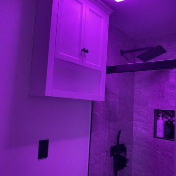 Elite Remodeling & Design - After remodel guest bathroom. Vent hood with changing light colors. - General Contractors Near Me - San Diego, California