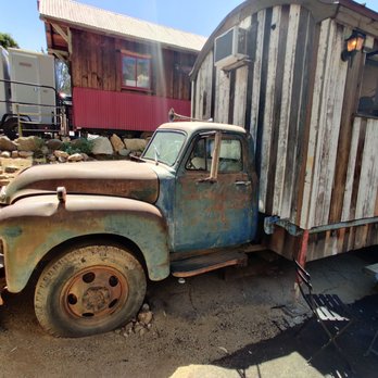 Old Truck - a rusted out truck with a trailer in the back - Coffee & Tea Near Me - Cornell, California