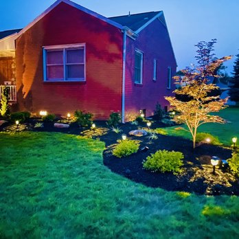 Trpcic Landscaping & Home Improvements - a red house at night - Landscaping Near Me - Pittsburgh, Pennsylvania