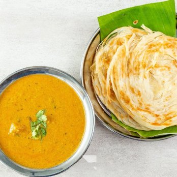 Madurai Kitchen - a plate of roti and a bowl of soup - Indian Near Me - Arlington Heights, Illinois
