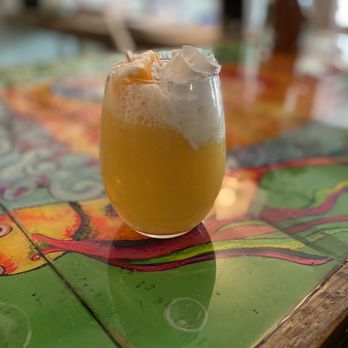 Cafe Koa - a glass of beer on a table - Cafes Near Me - Southport, North Carolina