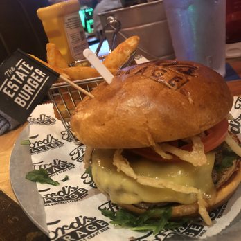 Ford's Garage Wesley Chapel - Black Angus, Smoked Gouda, Sweet Red Onion Marmalade, Arugula, Tomato, Fried Onion Straws,.White Truffle Bacon Aioli, Brioche Bun - Burgers Near Me - Lutz, Florida Ford's Garage Wesley Chapel - Black Angus, Smoked Gouda, Sweet Red Onion Marmalade, Arugula, Tomato, Fried Onion Straws,.White Truffle Bacon Aioli, Brioche Bun - Burgers Near Me - Lutz, Florida