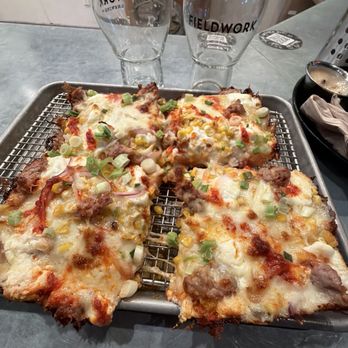 Fieldwork - Dad joke: garlic purée, green onions, sausage, roasted yellow, corn, mozzarella, ricotta, Calabrian, and red onion - Salad Near Me - Corte Madera, California Fieldwork - Dad joke: garlic purée, green onions, sausage, roasted yellow, corn, mozzarella, ricotta, Calabrian, and red onion - Salad Near Me - Corte Madera, California