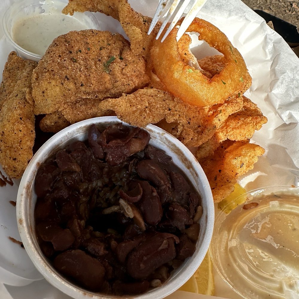 Fishbone Seafood Hawthorne - Catfish, red beans and rice, with onion rings. Some parts on the catfish were too salty and others lacking flavor. - Seafood Near Me - Hawthorne, California