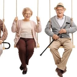 SeniCare Plus - Four seniors sitting on swings smiling and laughing