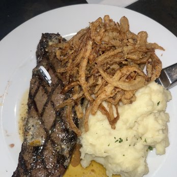 Chris McD's - Kansas City strip with mashers, onion straws - Steakhouses Near Me - Columbia, Missouri