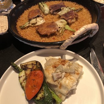 MAD - Pato (duck leg) rice and rodaballo (turbot) which is the fish + veggies - Spanish Near Me - Houston, Texas MAD - Pato (duck leg) rice and rodaballo (turbot) which is the fish + veggies - Spanish Near Me - Houston, Texas