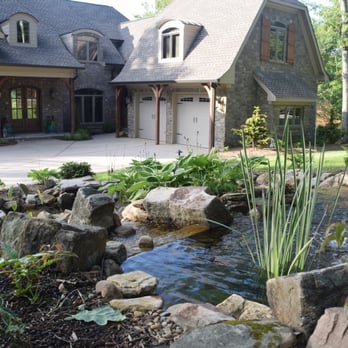Earthadelic - a house with a pond in front of it - Landscaping Near Me - Knoxville, Tennessee