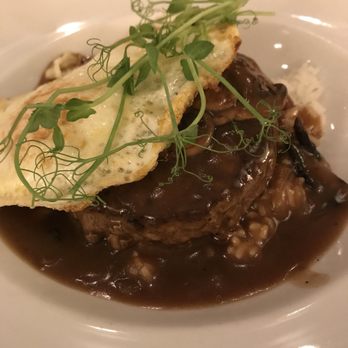 M.A.C. 24/7 - Loco Moco with a wagyu beef patty over medium fried eggs covered in mushroom gravy ... all on a bed of rice - American Near Me - Honolulu, Hawaii