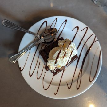 The Grand - Chocolate brownie with a scoop of ice cream - American Near Me - Astoria, New York The Grand - Chocolate brownie with a scoop of ice cream - American Near Me - Astoria, New York