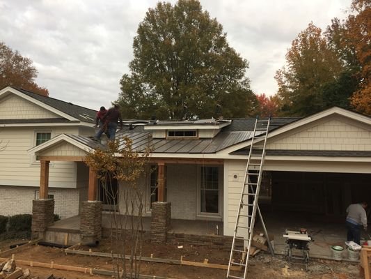 Slide of Tip Top Roofing