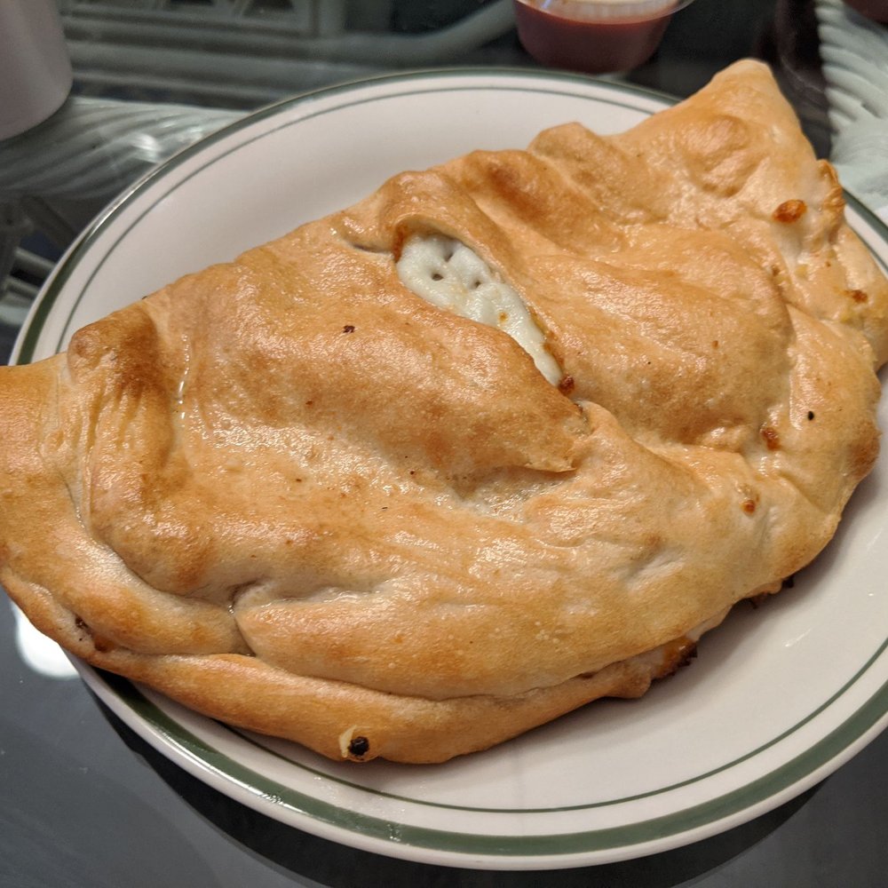 Bella's New York Pizza - Yummy cheesy Calzone - Pizza Near Me - Calabash, North Carolina Bella's New York Pizza - Yummy cheesy Calzone - Pizza Near Me - Calabash, North Carolina