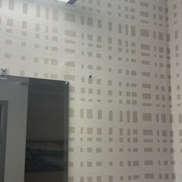 Poor quality control.   Freshly renovated new wallpaper and these holes in the wall.