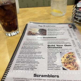 Eggspresso - a menu and a drink on a table - Breakfast & Brunch Near Me - Bannockburn, Illinois