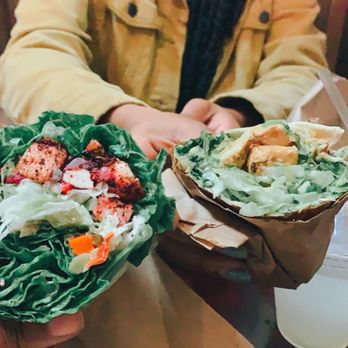 Cafe 53 - (Left) Sumac Chicken Sandwich lettuce wrap with giardiniera peppers and garlic Vegan Chicken Pesto (Right) - Coffee & Tea Near Me - Chicago, Illinois