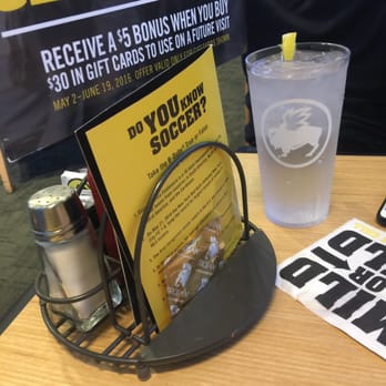 Buffalo Wild Wings - Reaching for condiments, I notice an unopened condom! - American Near Me - Oceanside, California