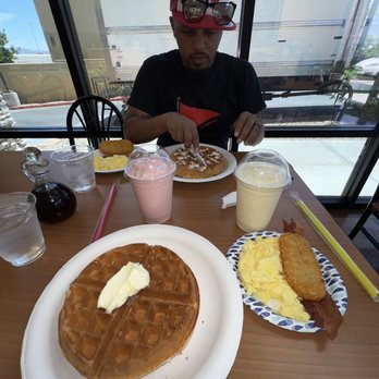 Waffles Cafe - Breakfast Special with scrambled eggs, bacon, and hash browns. Strawberry banana smoothie and pineapple coconut smoothie. - Coffee & Tea Near Me - Las Vegas, Nevada