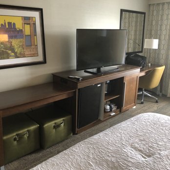 Hampton Inn & Suites Columbus Hilliard - Notice the cabinet under the TV and how the stuffed a small fridge, microwave and the coffee maker is on he bottom shelf. - Hotels Near Me - Hilliard, Ohio