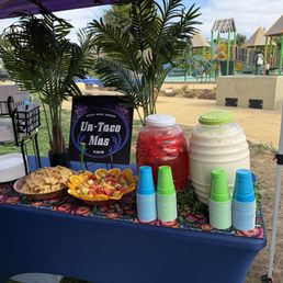 Agua Frescas, chips and fruit bowl