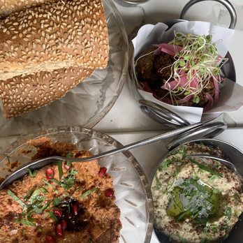 Abbalé - Israeli bagel, muhammara (bottom left), baba gannoush (smoky and delicious!), falafel (top right) - Mediterranean Near Me - Miami Beach, Florida Abbalé - Israeli bagel, muhammara (bottom left), baba gannoush (smoky and delicious!), falafel (top right) - Mediterranean Near Me - Miami Beach, Florida