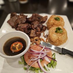 Fried sticky rice patties with grilled pork