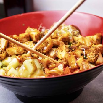 Off The Rock Tavern - a bowl of food with chopsticks - Sports Bars Near Me - Naples, Florida
