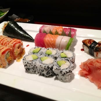 Sakura - An assortment of rolls including a California roll, rainbow roll, spicy tuna hand roll, another spicy salmon roll, and unagi. - Japanese Near Me - Charlottesville, Virginia