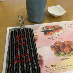 a menu and a cup of coffee a menu and a cup of coffee