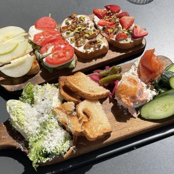 Postino Highlands Ranch - Brie, applie & fig spread, mozzarella tomato & basil, ricotta dates & pistachio, and strawberry cheesecake smoked salmon board - Wine Bars Near Me - Highlands Ranch, Colorado Postino Highlands Ranch - Brie, applie & fig spread, mozzarella tomato & basil, ricotta dates & pistachio, and strawberry cheesecake smoked salmon board - Wine Bars Near Me - Highlands Ranch, Colorado