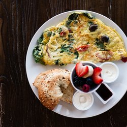 Greeko’s Grill & Cafe - Try our GREEKO'S BREAKFAST 10.99 Large omelette, fruit and a toasted bagel OR croissant -Choose Deli, Greek, Western, Veggie Omelette
