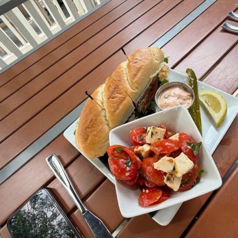 Rick's On Main - Blackened Grouper Sandwich with Caprese Salad - New American Near Me - East Aurora, New York Rick's On Main - Blackened Grouper Sandwich with Caprese Salad - New American Near Me - East Aurora, New York