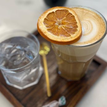 Reverie Coffee & Teahouse - an orange slice on top - Coffee & Tea Near Me - Rogers, Arkansas Reverie Coffee & Teahouse - an orange slice on top - Coffee & Tea Near Me - Rogers, Arkansas
