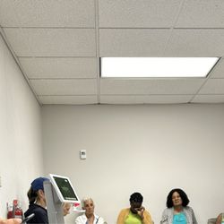 Quest Diagnostics - Smaller than a master bedroom. 15 seats and people waiting outside.
