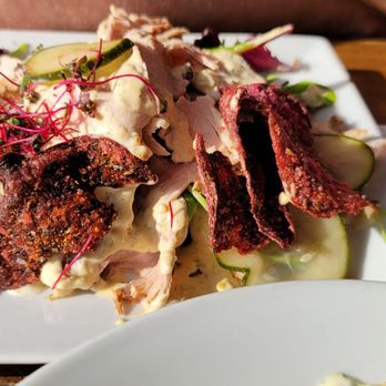 Three Vikings - a plate of food on a table - Pubs Near Me - Edmonton, Alberta Three Vikings - a plate of food on a table - Pubs Near Me - Edmonton, Alberta